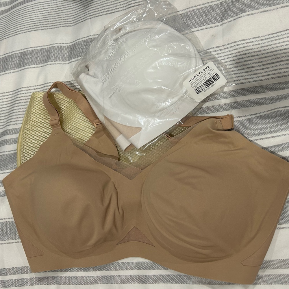 2 Honeylove liftwear CrossOver Bras size 2x, one in white and one in nude.